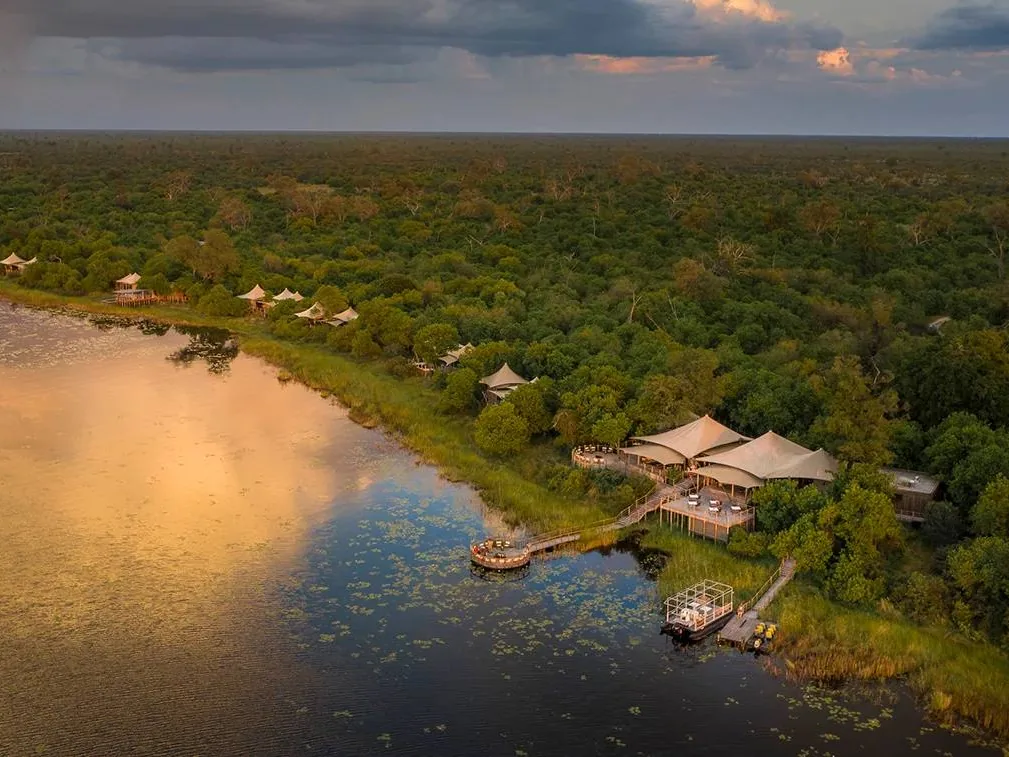 DumaTau camp on the Linyanti waterway from the air, with its lagoon at sunset