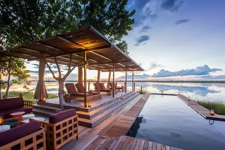 A deck and long plunge pool beside the lagoon at DumaTau
