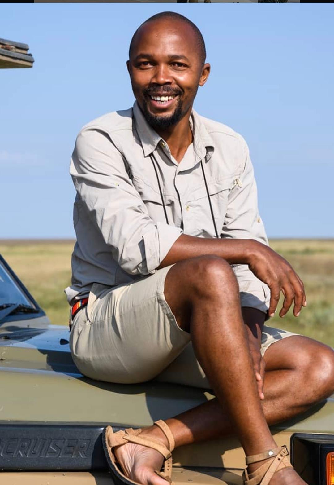 Raphiele Mpille, senior safari guide at Kingse Safaris, on a Land Cruiser in northern Tanzania