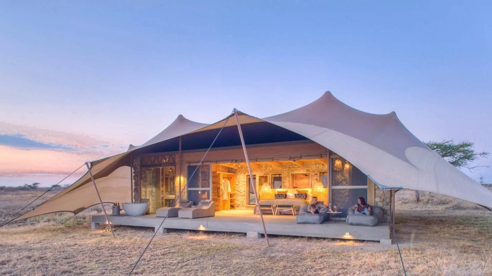 A tented suite at Namiri Plains at dusk on the eastern Serengeti plains