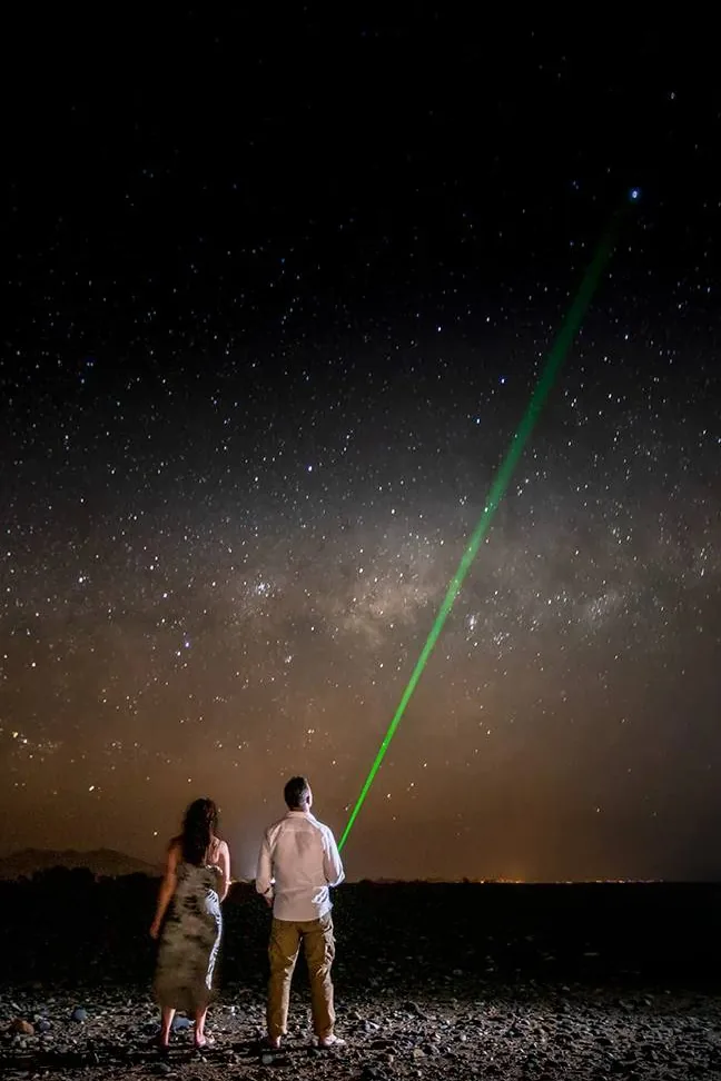 Two guests looking up at the Milky Way at Little Kulala, near Sossusvlei