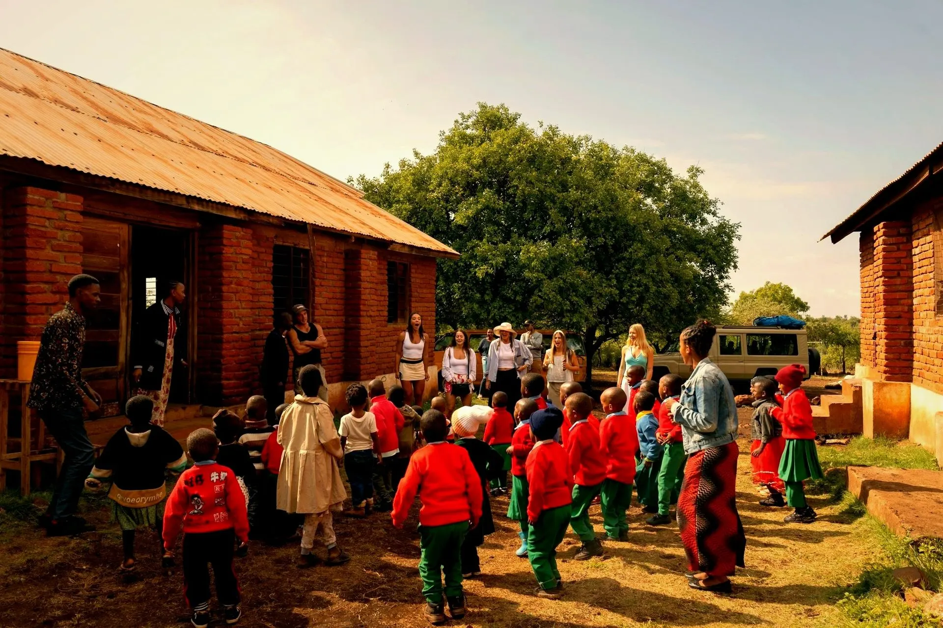 Kingse Safaris guests and the schoolchildren of Karatu together outside the community school in Tanzania