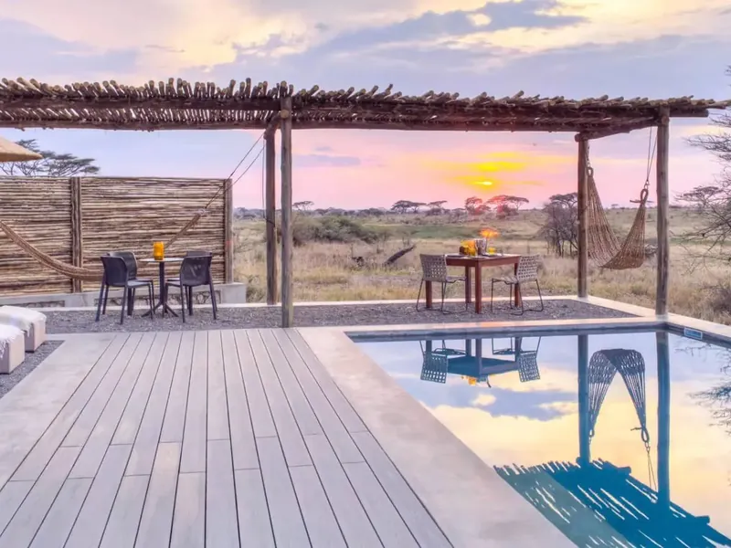 The pool deck at Namiri Plains at sunset, looking out over the eastern Serengeti