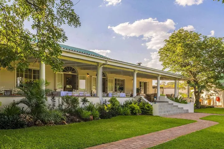 The veranda and lawn at Batonka Guest Lodge