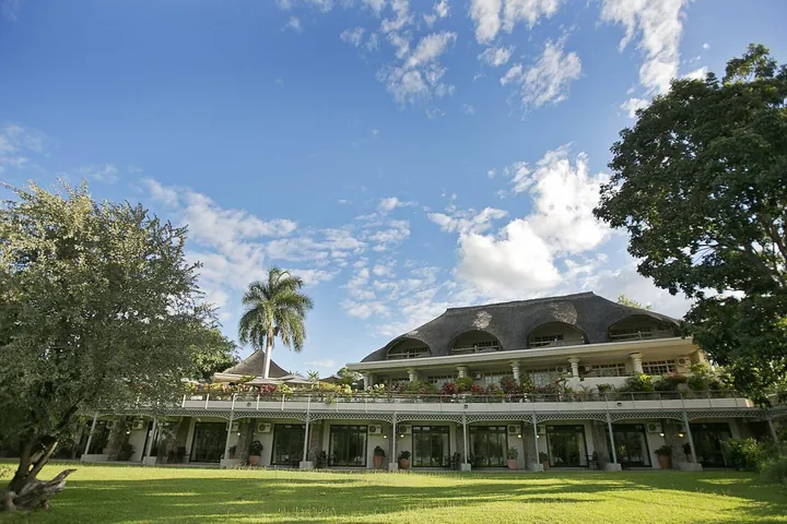 The lodge and its lawn at Ilala Lodge Hotel