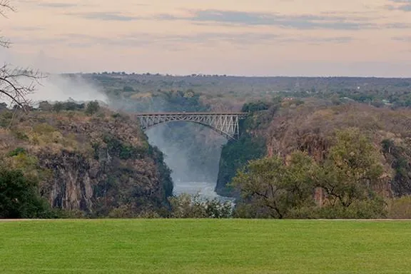 The lawn running down to the gorge and the Victoria Falls Bridge, seen from The Victoria Falls Hotel
