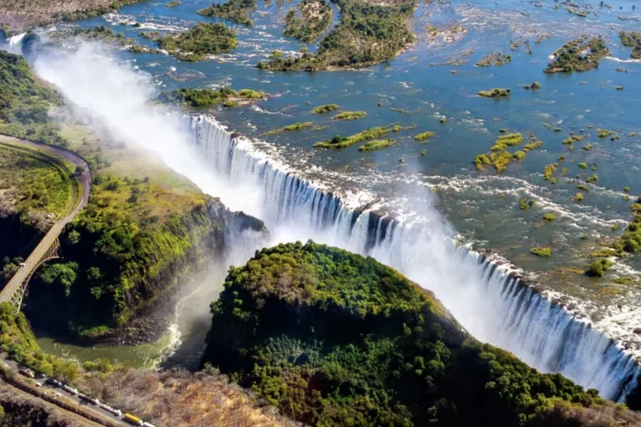 Victoria Falls from the air, with heavy spray rising over the full width of the falls