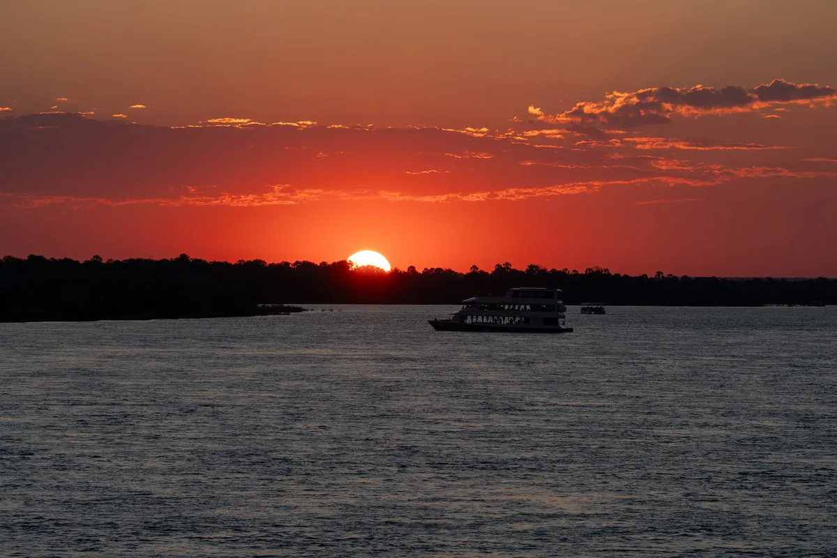 A cruise boat on the Zambezi at sunset