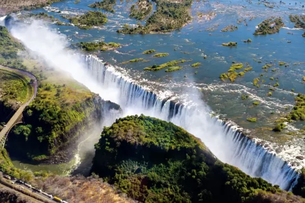The falls and the gorge from the air, with the Victoria Falls Bridge crossing the gorge
