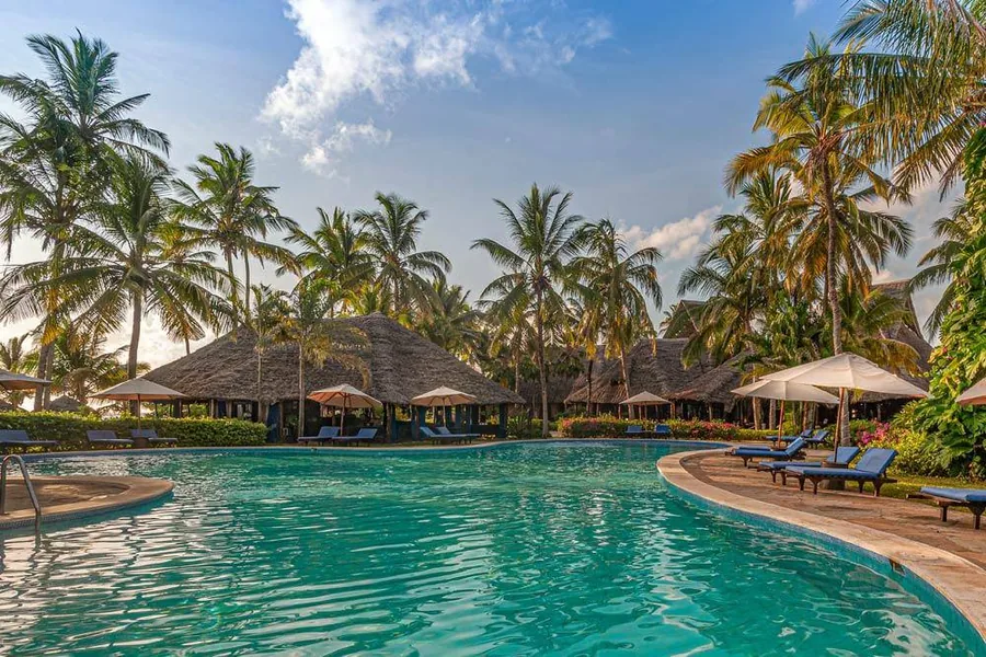 Palms and a pool at a beach resort on the east coast of Zanzibar