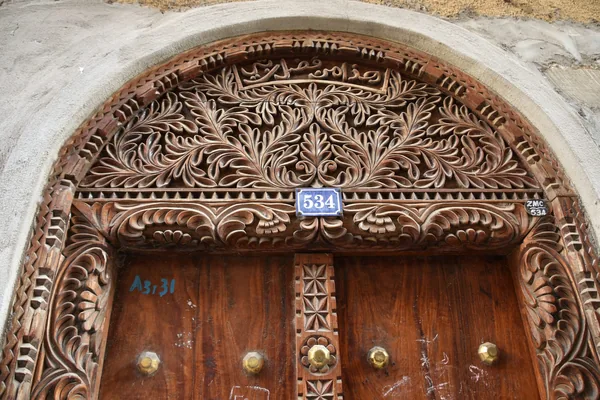 A carved wooden door in Stone Town